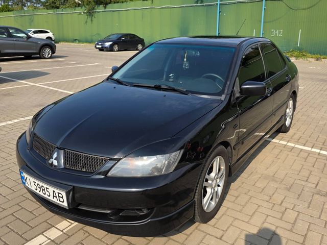 Mitsubishi Lancer - фото 1