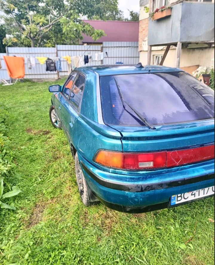 Mazda 323 - фото 2