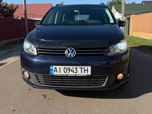 Volkswagen Touran - фото 1