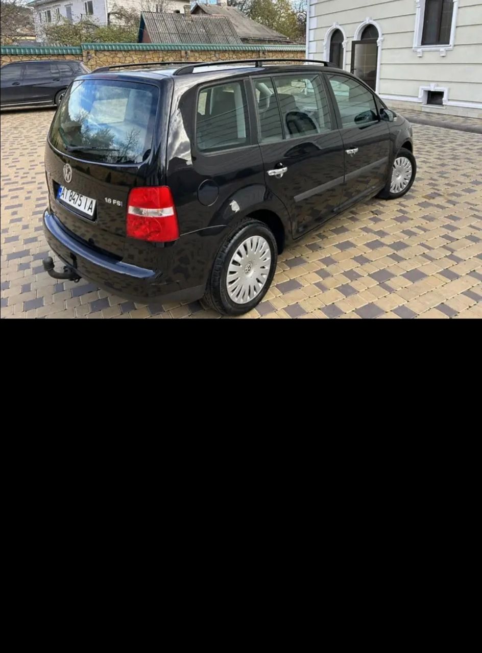 Volkswagen Touran - фото 5