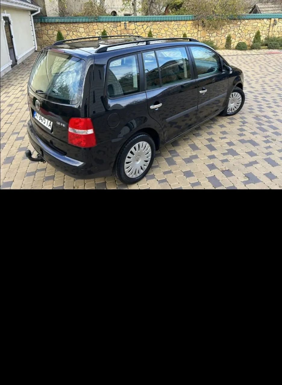 Volkswagen Touran - фото 4