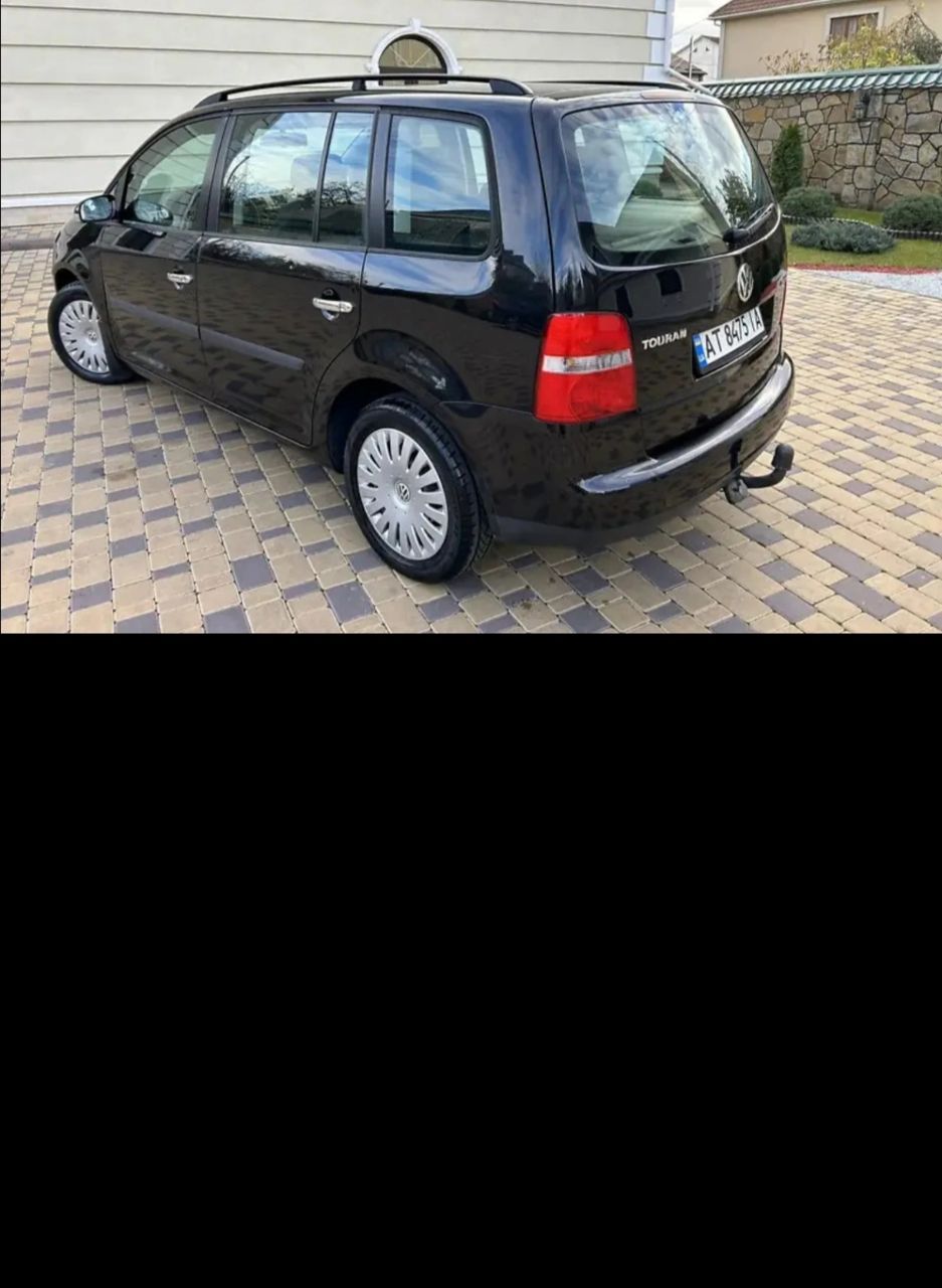 Volkswagen Touran - фото 6