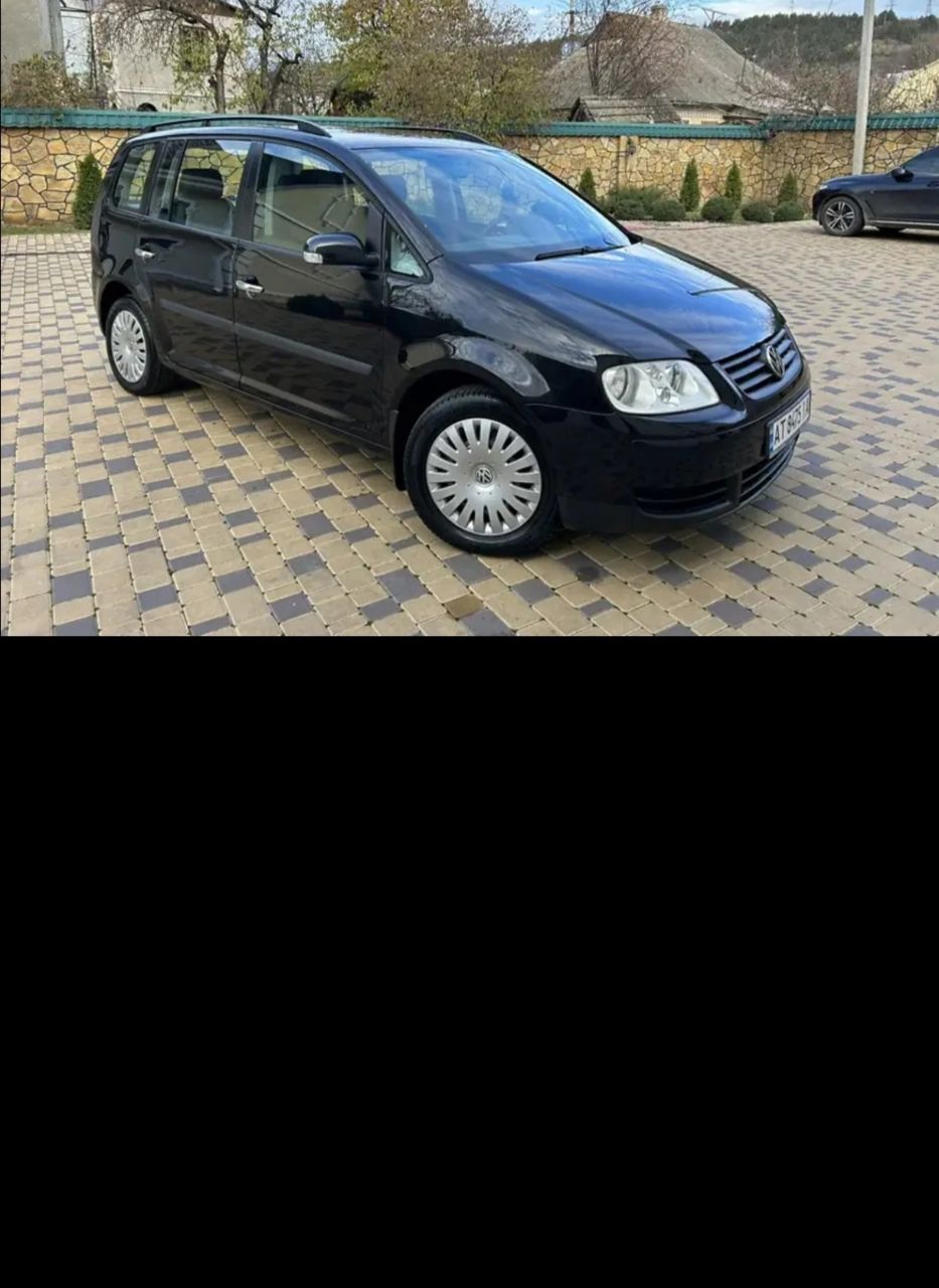 Volkswagen Touran - фото 2
