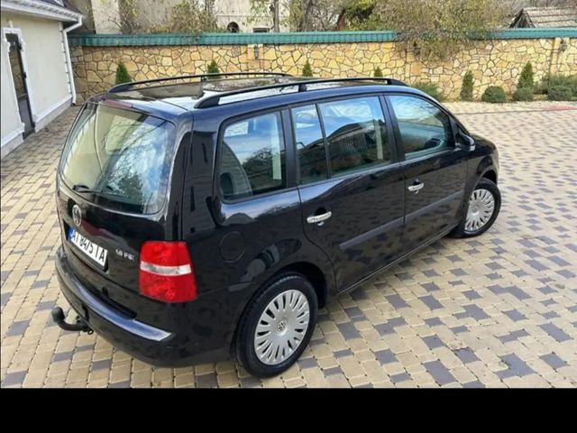 Volkswagen Touran - фото 4