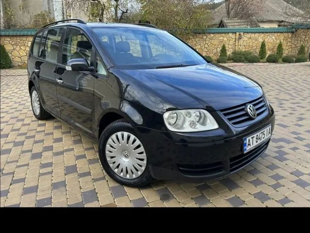 Volkswagen Touran - фото 3