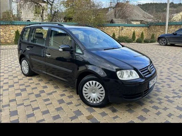 Volkswagen Touran - фото 2