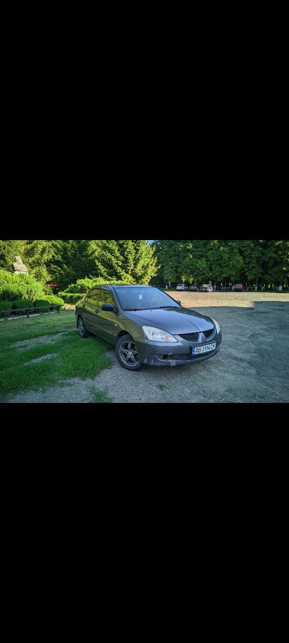 Mitsubishi Lancer - фото 1