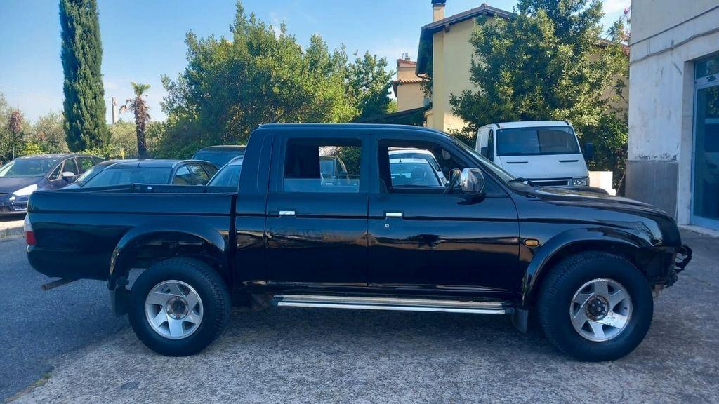 Mitsubishi L200 - фото 1