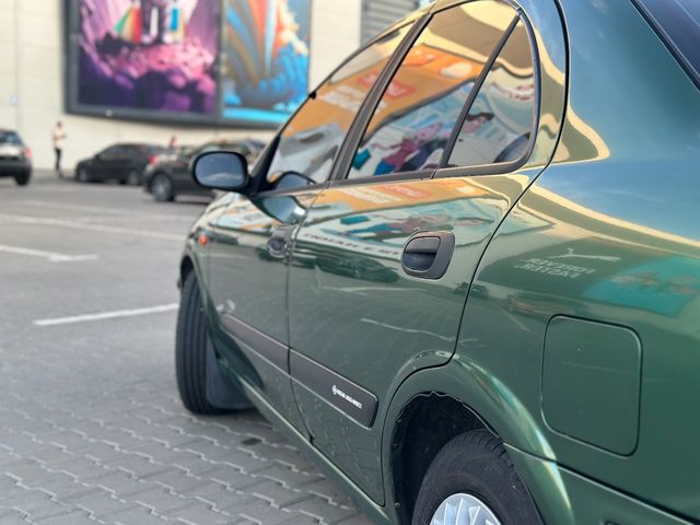 Nissan Almera - фото 4
