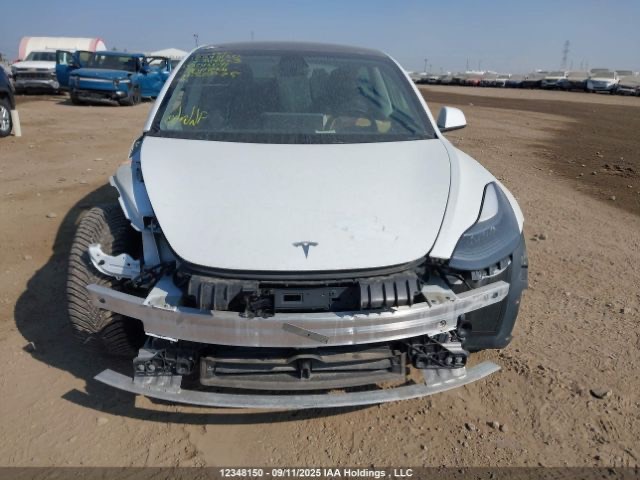 Tesla Model 3 - фото 11