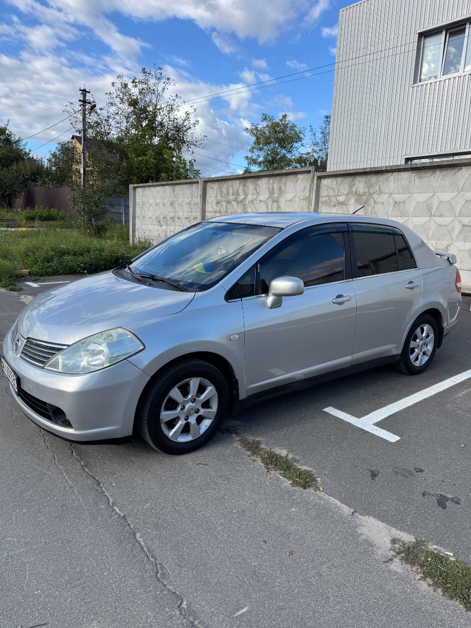 Nissan Tiida - фото 9