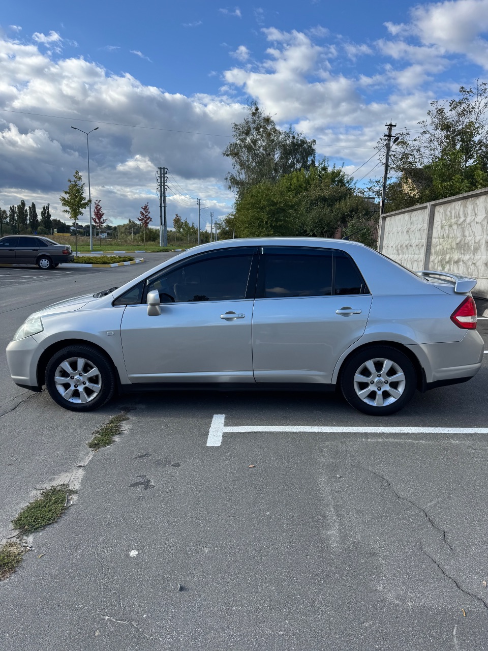 Nissan Tiida - фото 7