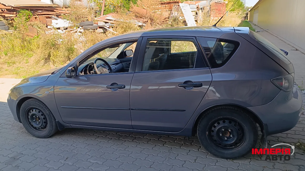Mazda 3 - фото 7