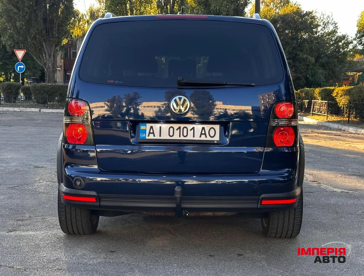 Volkswagen Touran - фото 11