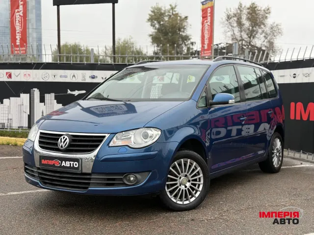 Volkswagen Touran - фото 1
