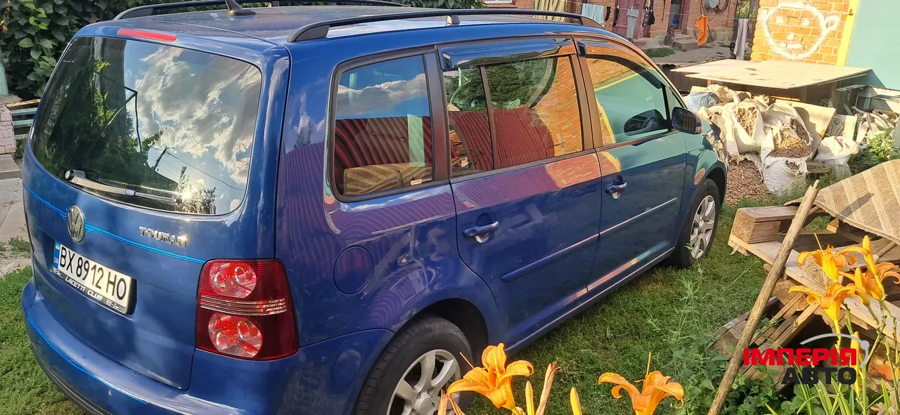 Volkswagen Touran - фото 4