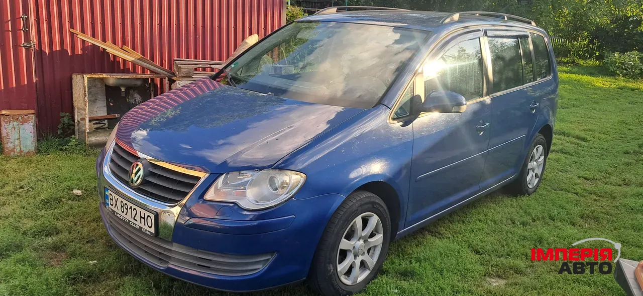 Volkswagen Touran - фото 1