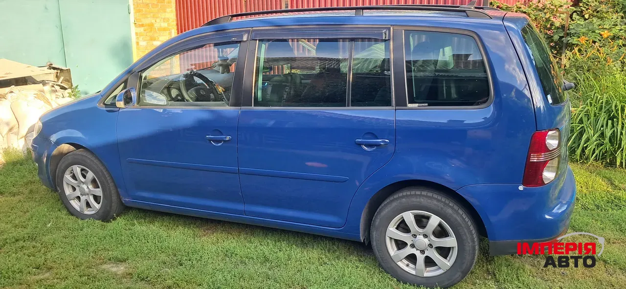 Volkswagen Touran - фото 8