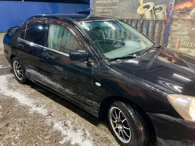 Mitsubishi Lancer - фото 2