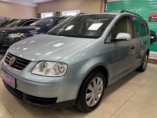 Volkswagen Touran - фото 1