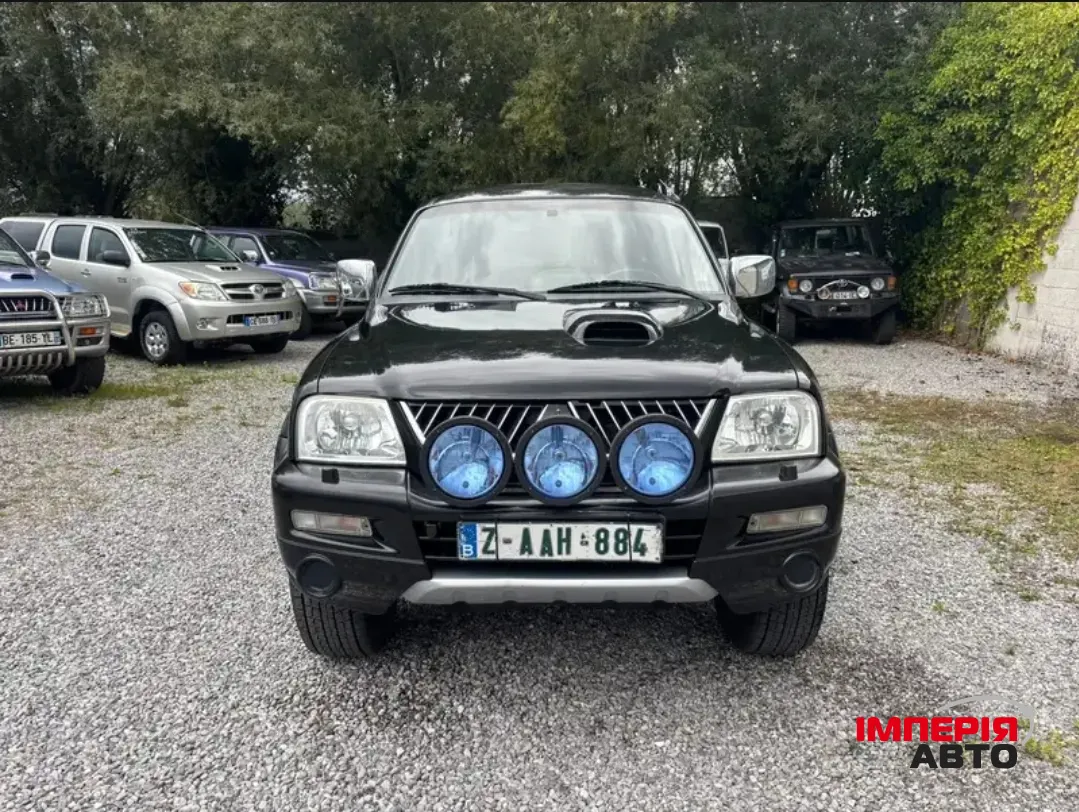 Mitsubishi L200 - фото 1