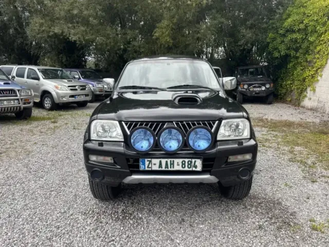 Mitsubishi L200 - фото 1