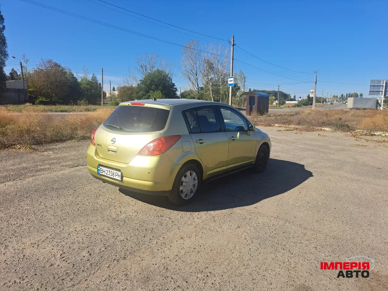 Nissan Tiida - фото 4