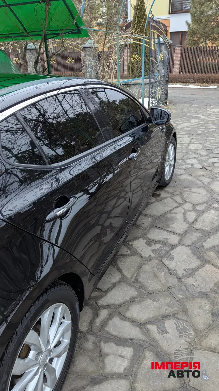 Kia Optima - фото 5