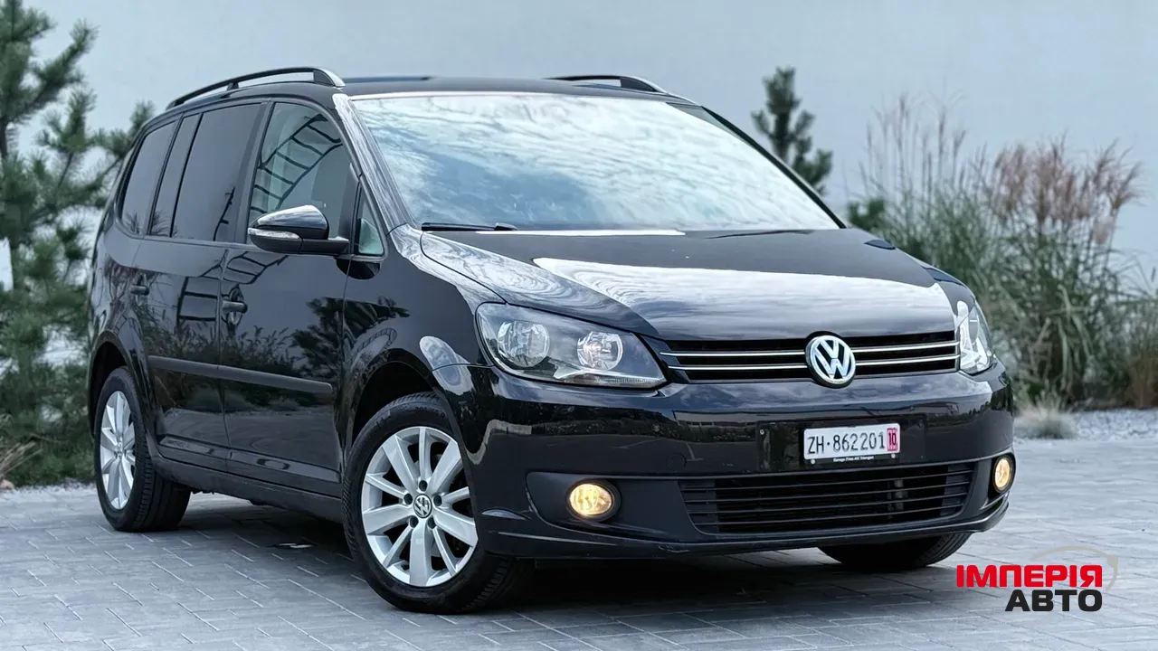 Volkswagen Touran - фото 1