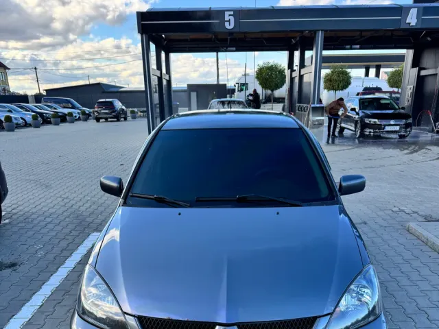 Mitsubishi Lancer - фото 1