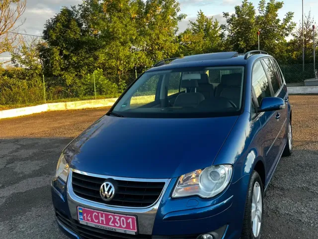 Volkswagen Touran - фото 1