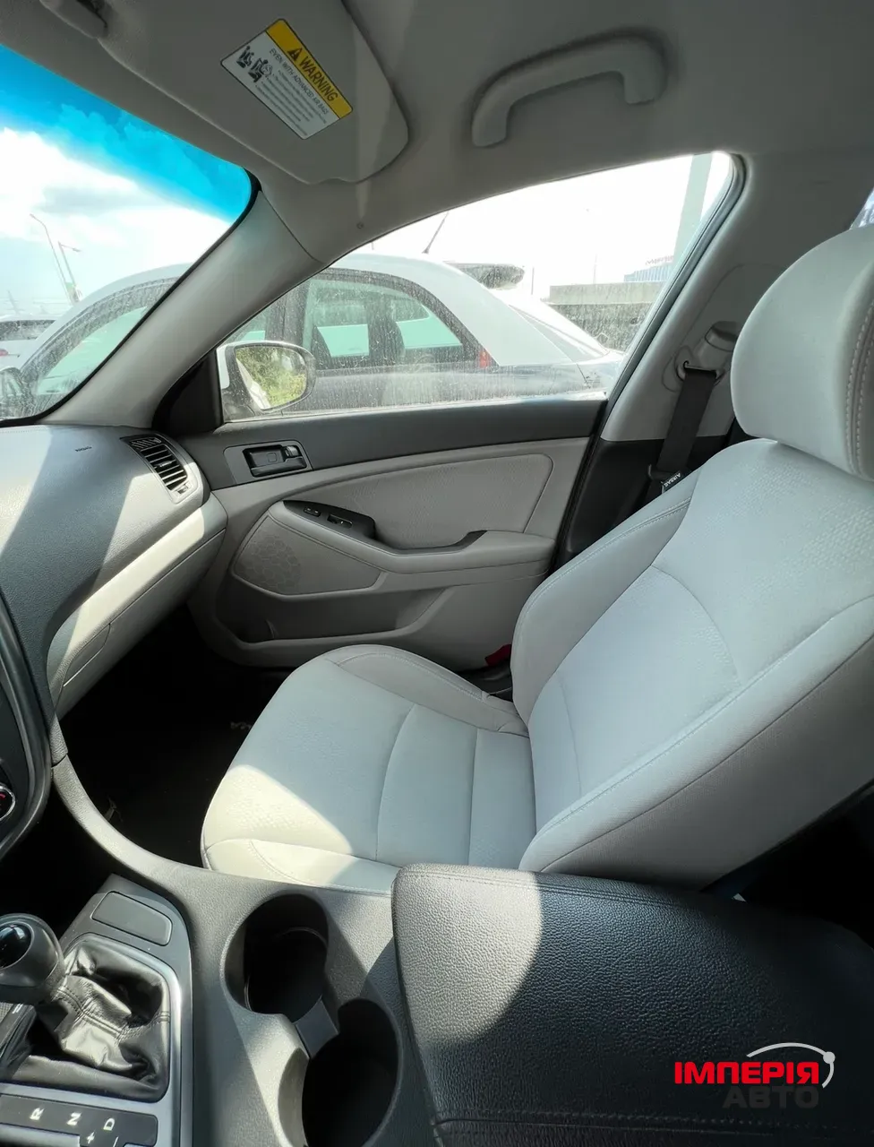 Kia Optima - фото 7