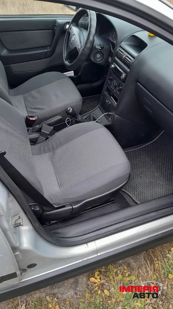 Opel Astra - фото 8