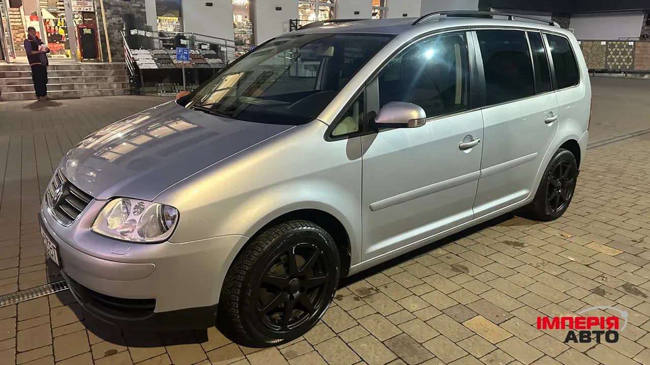 Volkswagen Touran - фото 5