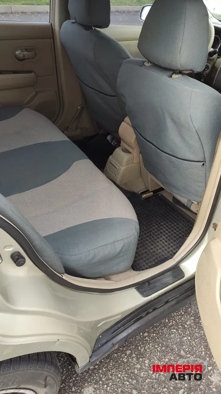 Nissan Tiida - фото 12