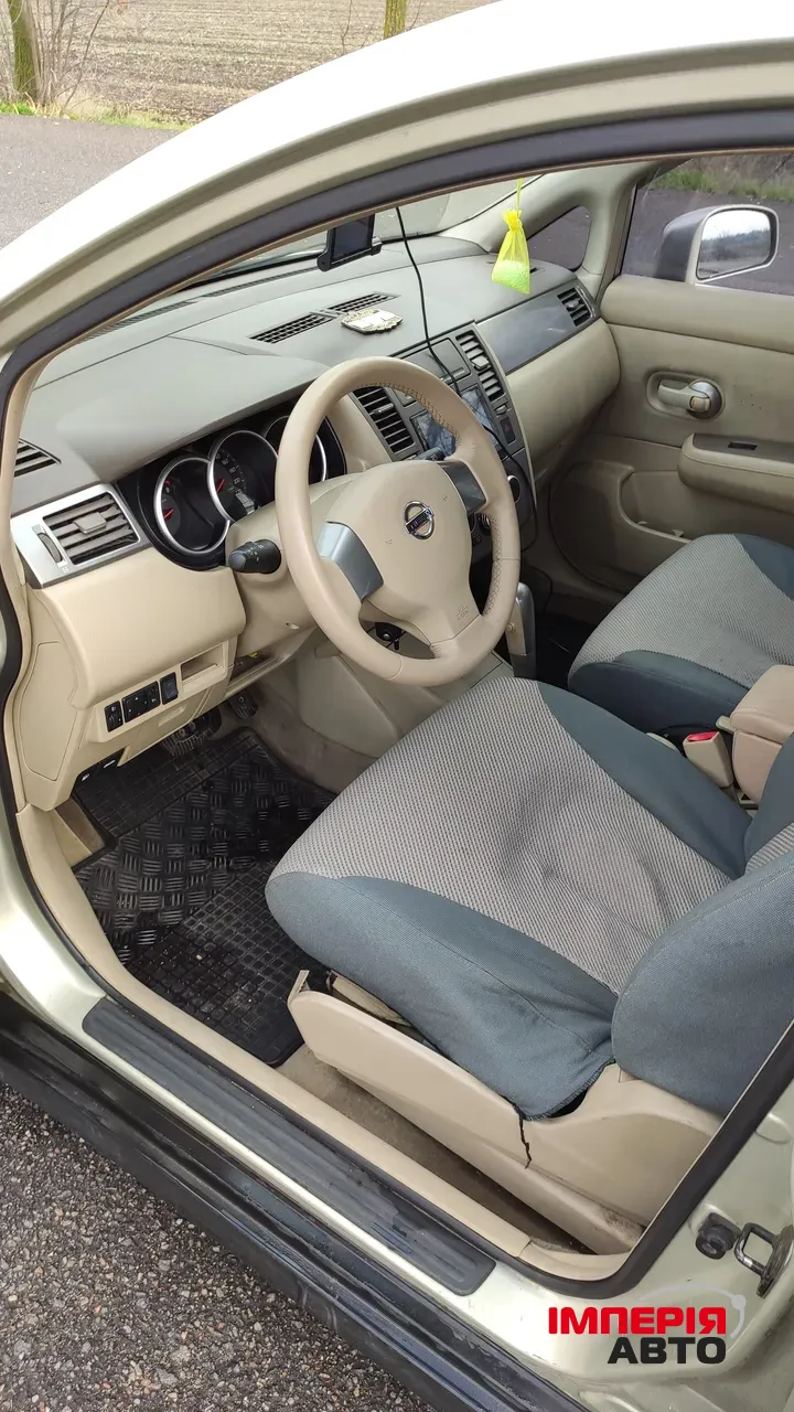 Nissan Tiida - фото 9