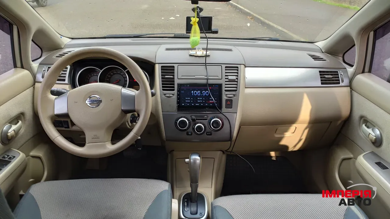 Nissan Tiida - фото 5