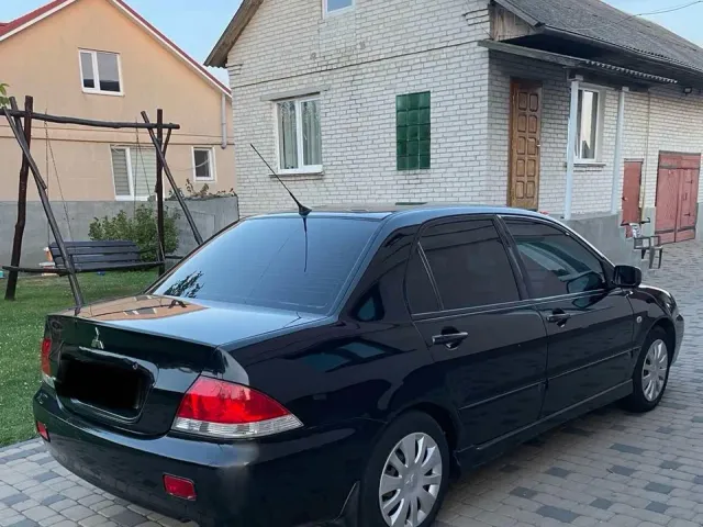 Mitsubishi Lancer - фото 3