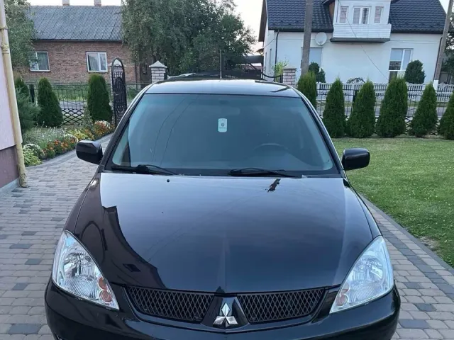 Mitsubishi Lancer - фото 1