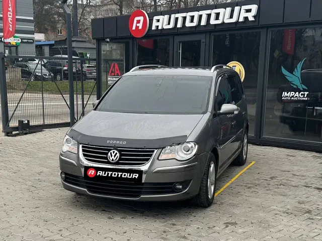 Volkswagen Touran - фото 1