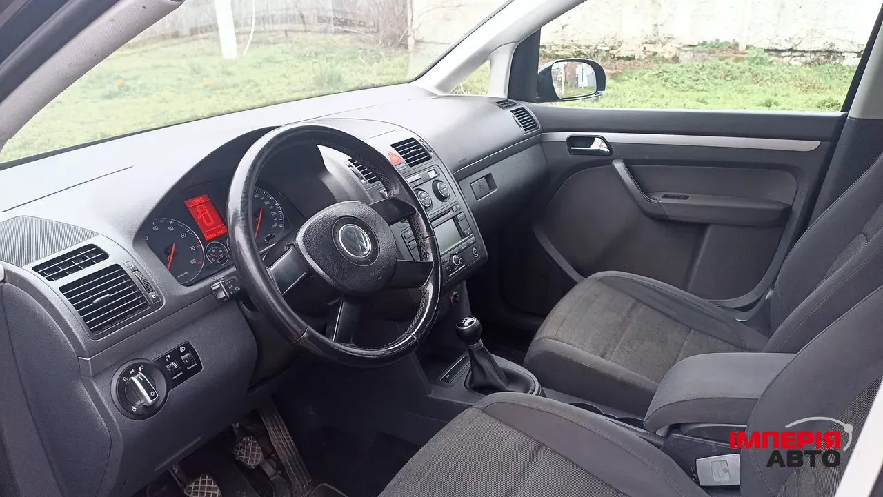 Volkswagen Touran - фото 5