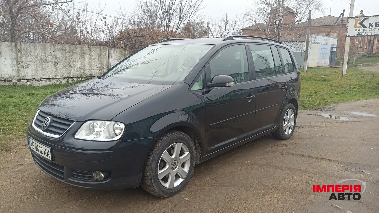 Volkswagen Touran - фото 11