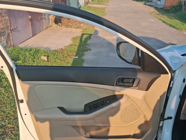 Kia Optima - фото 5