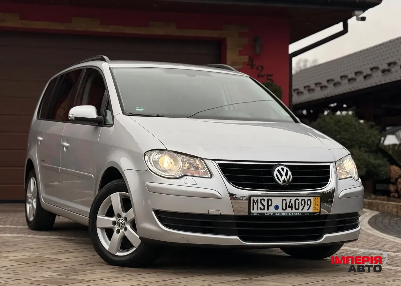 Volkswagen Touran - фото 1