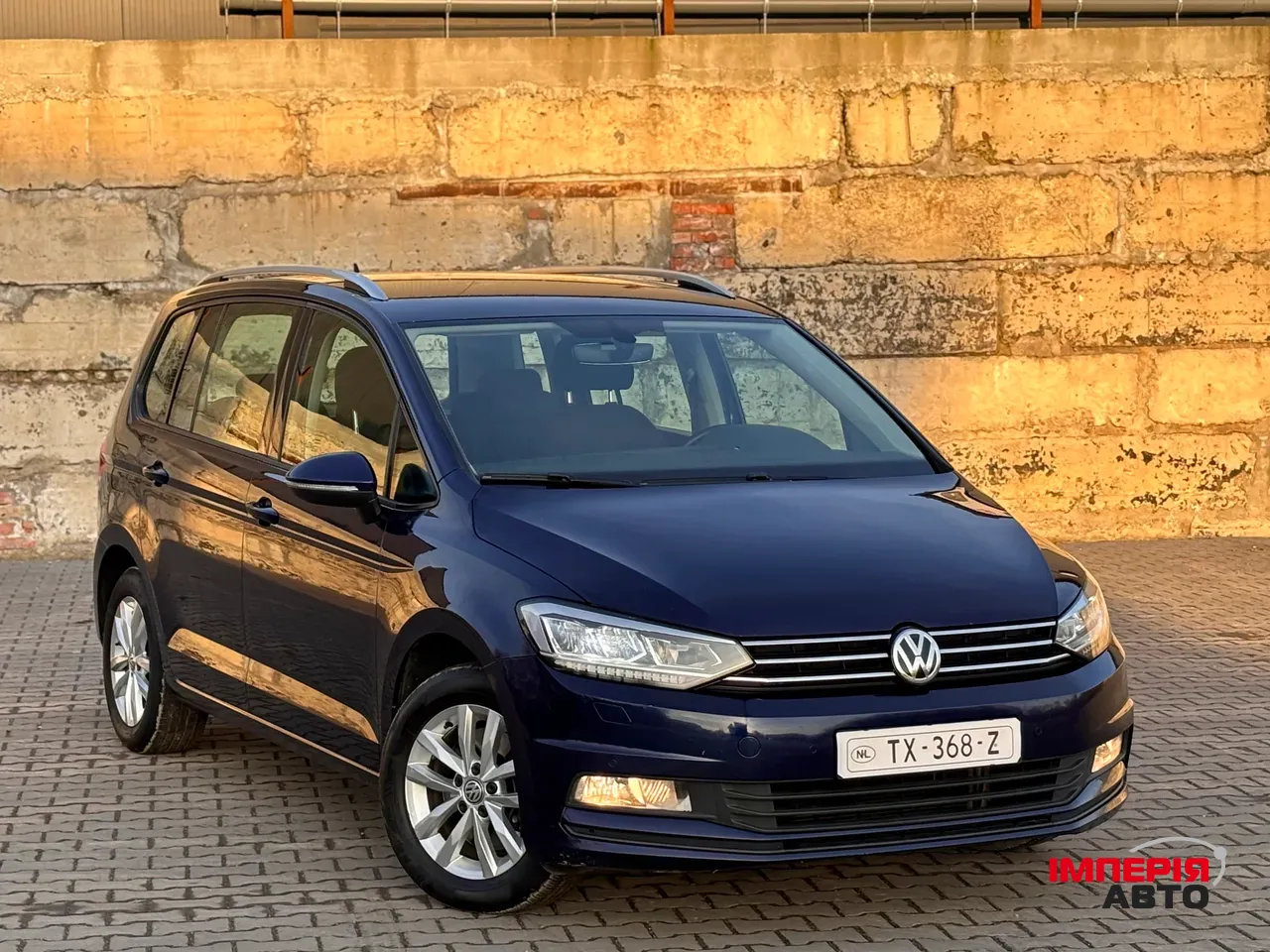 Volkswagen Touran - фото 1