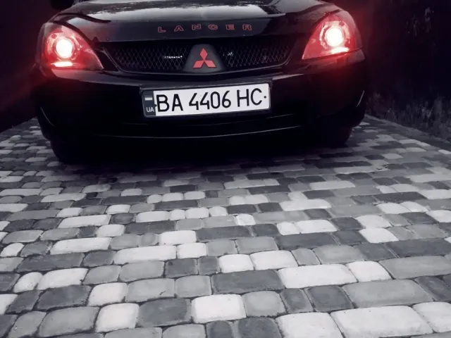 Mitsubishi Lancer - фото 1