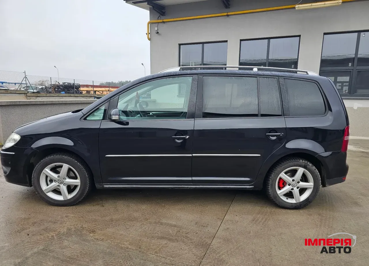 Volkswagen Touran - фото 12