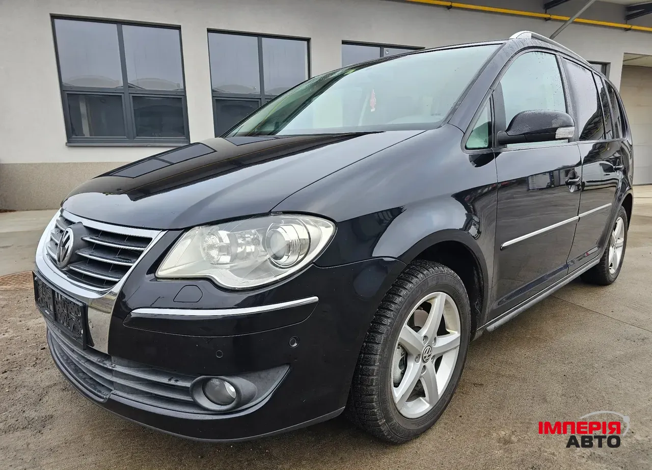 Volkswagen Touran - фото 1