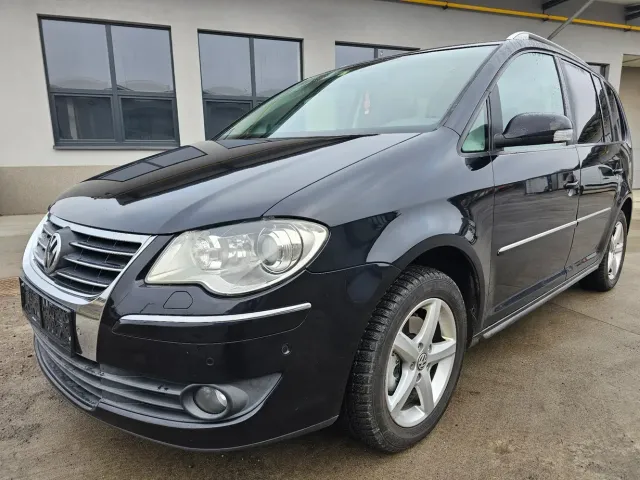Volkswagen Touran - фото 1