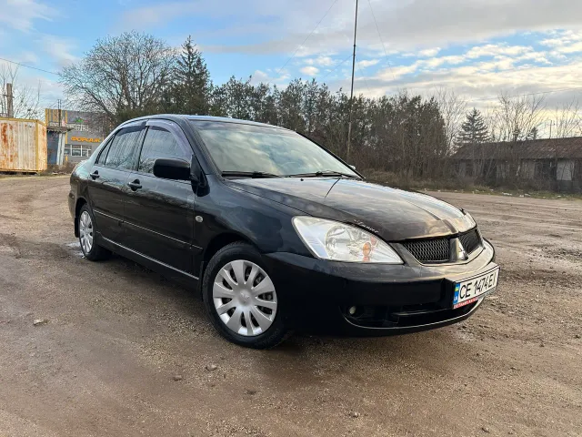 Mitsubishi Lancer - фото 1